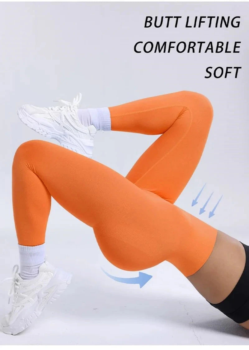 "Women Fitness Solid Color Seamless Leggings High Waist Push in orange, showcasing butt lifting and soft compression fit for yoga and workouts"