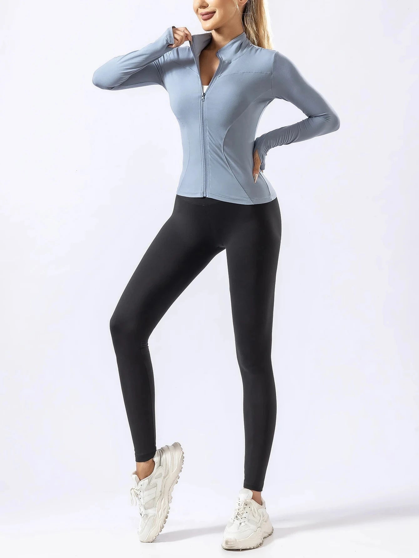 "Blue zip-up quick-dry yoga top with black leggings for women, designed for autumn and winter gym and running activities."