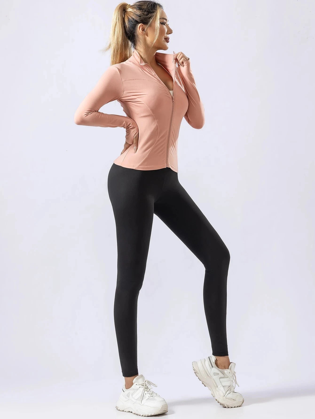 "Women's pink long-sleeve quick-dry yoga top and black leggings set, ideal for cold-weather workouts and professional gym wear."
