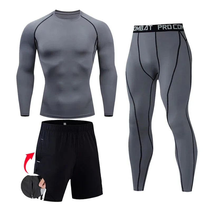 "Gray men's compression workout set with black seam accents, includes long-sleeve top, tights, and shorts for fitness training."