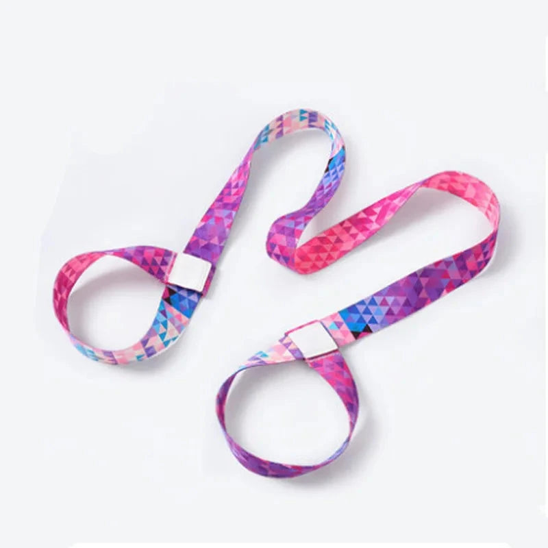 "Pink and purple geometric adjustable yoga mat strap with reinforced loops. Designed for mat carrying, stretching, and yoga practice support."