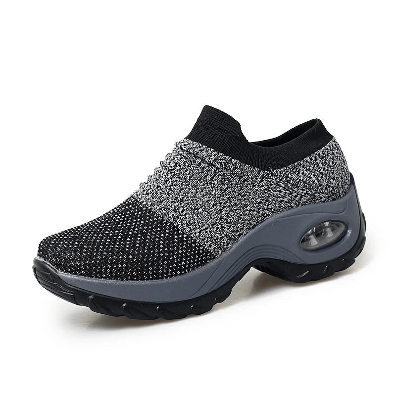 "Women Sneakers Fashion Breathable Walking Mesh Platform Shoes in black with slip-on design and cushioned sole for gym or casual wear."