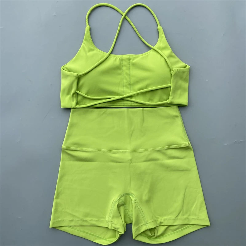 Green romper with thin straps on a gray background