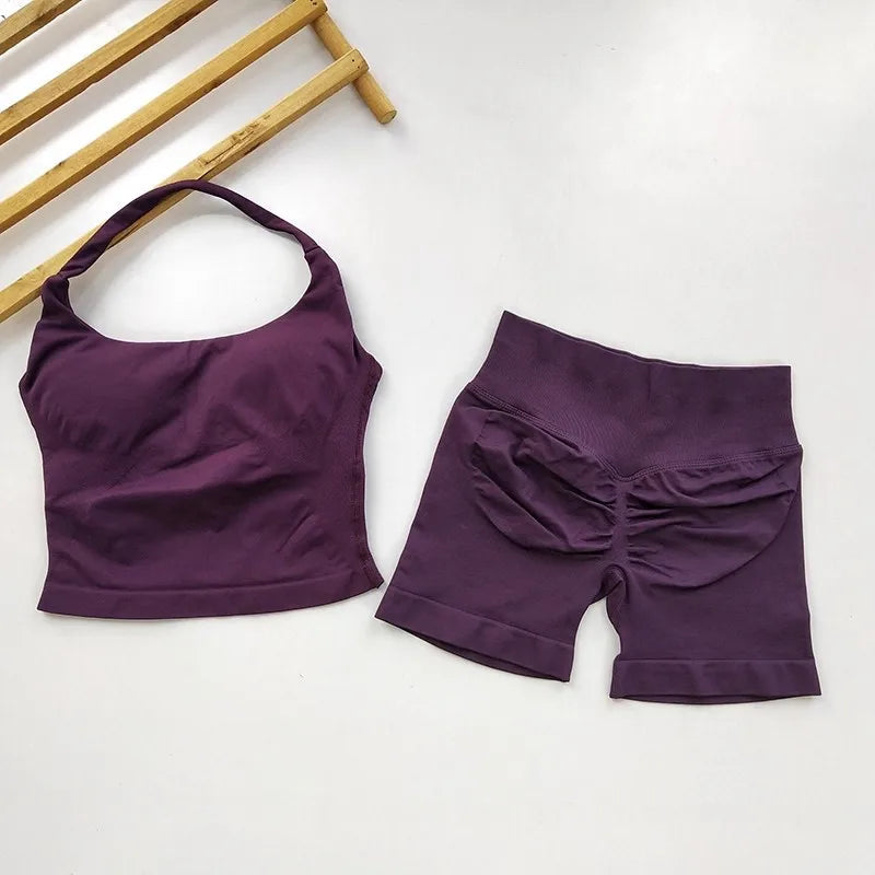 Purple sports bra and shorts set on a white background