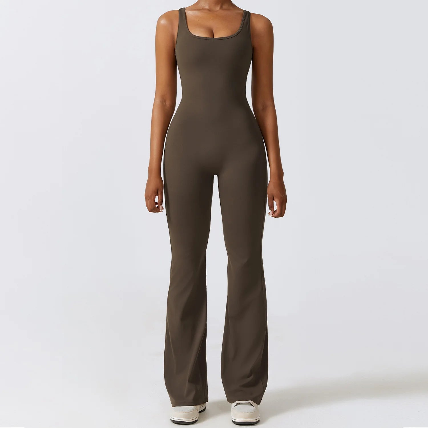 Person wearing a brown jumpsuit on a white background