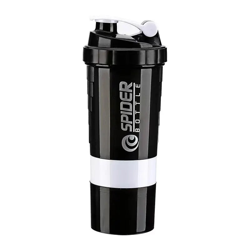 A black shaker bottle with a white logo reading 'SPIDER BOTTLE' and a white band around the middle, shown on a plain white background.