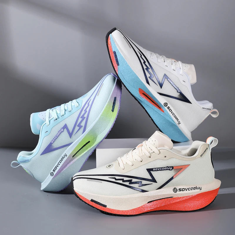 Three running shoes with colorful designs on a gray background