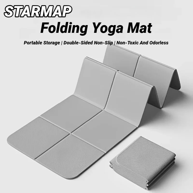 Gray folding yoga mat with 'StarMap' branding on a white background