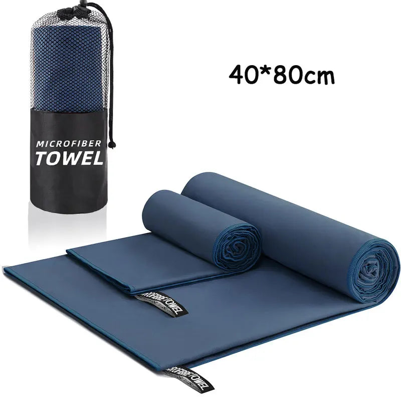 Blue microfiber towel with carrying case on a white background