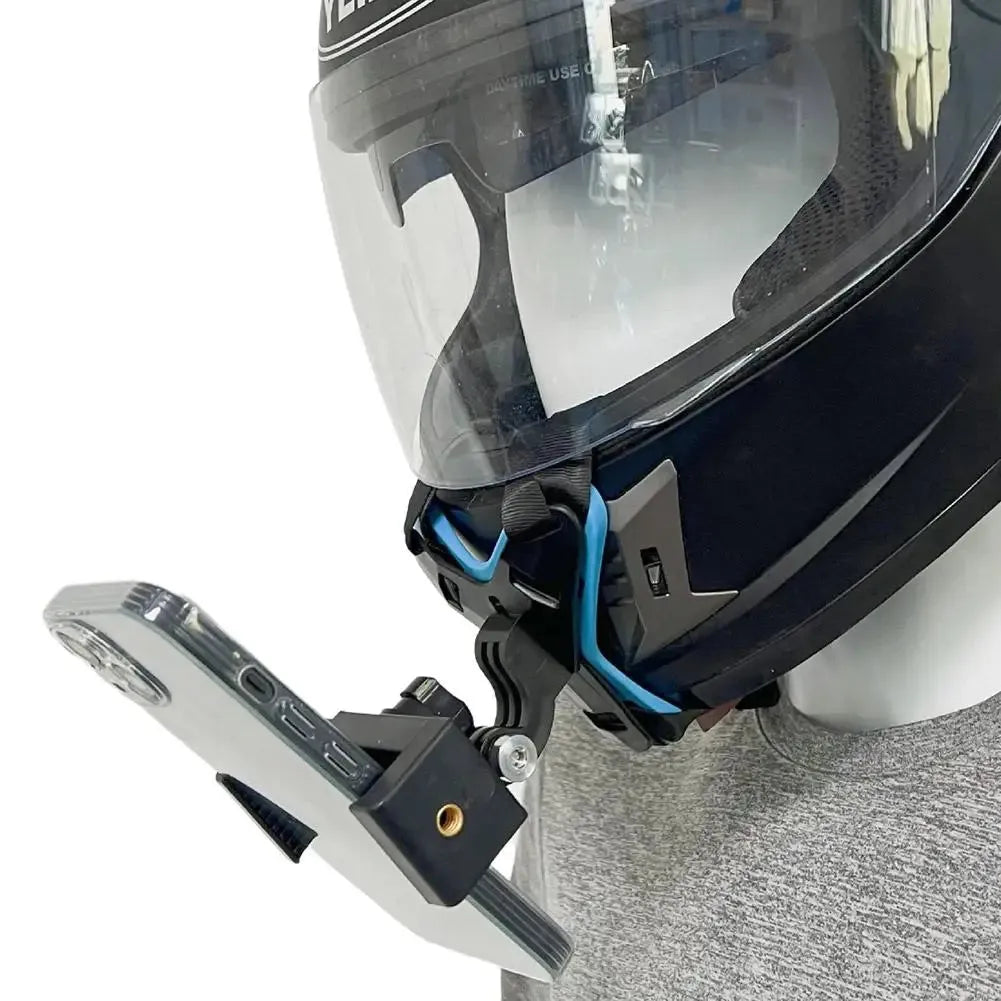 Side view of helmet-mounted phone holder securely attached to chin area for motorcycle riding.