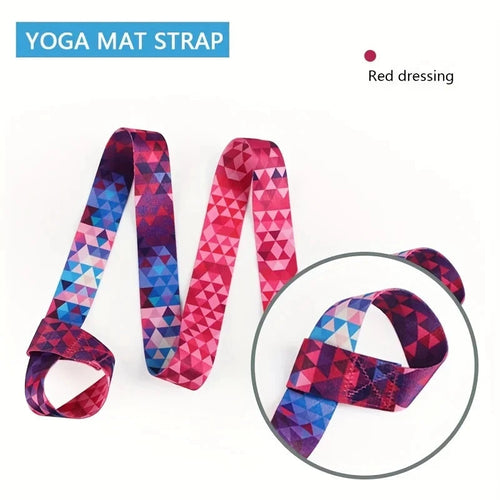Close-up of red geometric adjustable yoga mat strap labeled 'Red dressing' with durable stitching. Perfect for bundling and carrying yoga mats.
