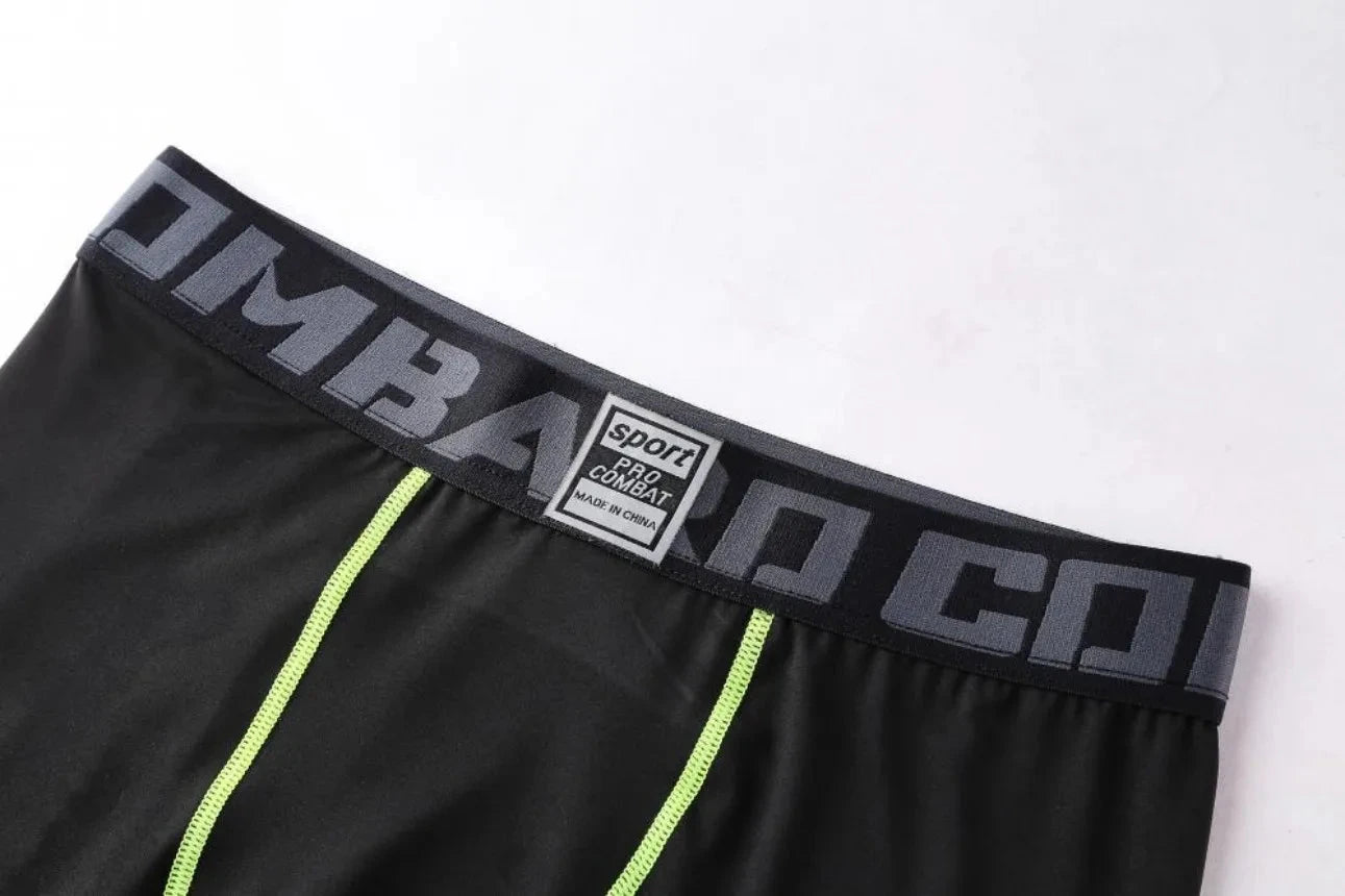 Elastic waistband with 'COMBAT' branding on black Men Bodybuilding Sportswear Clothes Fitness Suit pants for secure fit.
