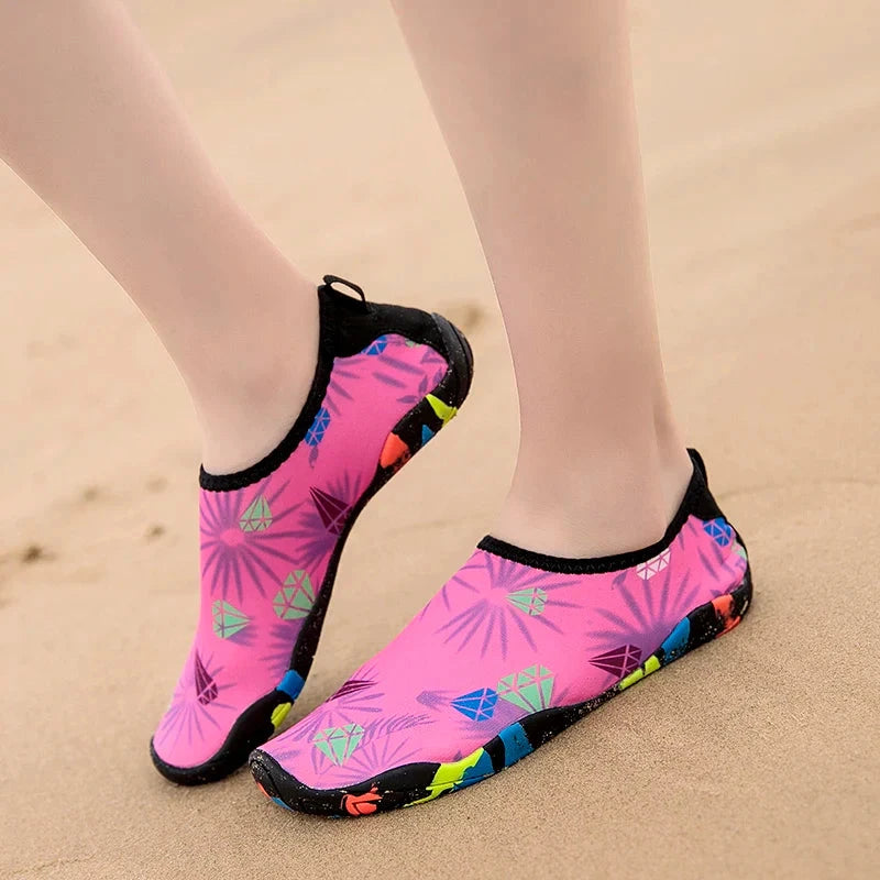Unisex pink beach aqua shoes with colorful palm leaf design, perfect for outdoor activities and quick-drying comfort.