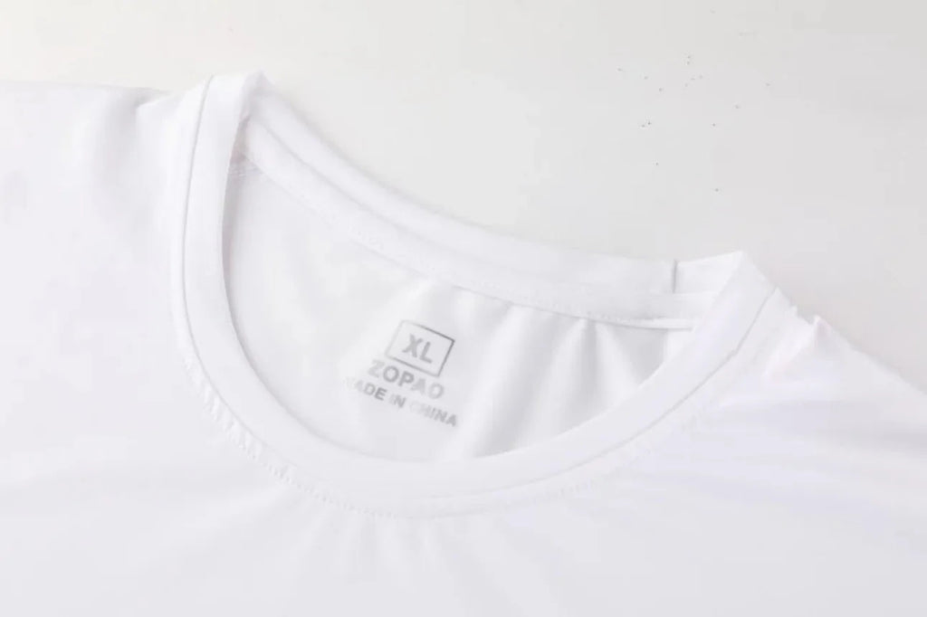 Close-up of neckline on white Men Bodybuilding Sportswear Clothes Fitness Suit showing size label and fabric texture.