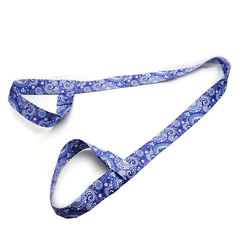 Blue paisley patterned adjustable yoga mat strap with dual loops for secure mat holding. Ideal for yoga, Pilates, and stretching routines.
