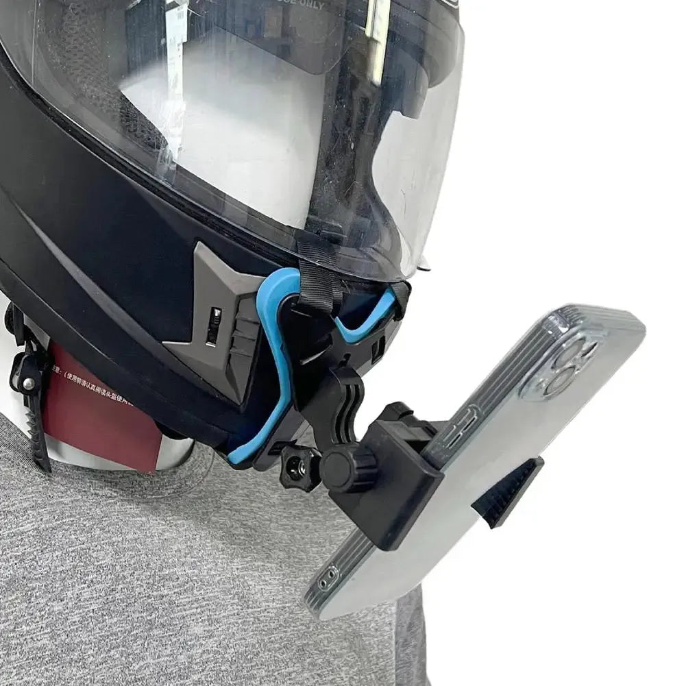Close-up of helmet-mounted mobile phone holder for motorcycle riding, attached securely to chin area.