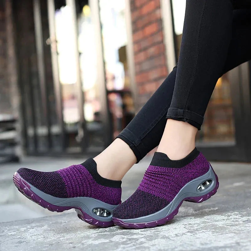 Women Sneakers Fashion Breathable Walking Mesh Platform Shoes in black with slip-on design and cushioned sole for gym or casual wear.