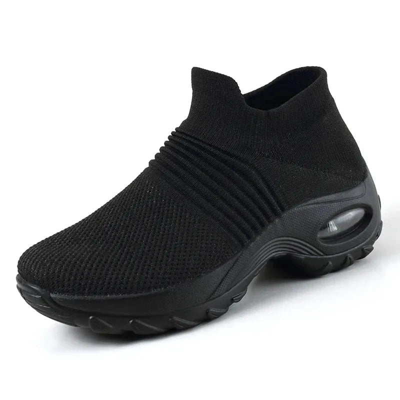 Women Sneakers Fashion Breathable Walking Mesh Platform Shoes in black with slip-on design and cushioned sole for gym or casual wear.