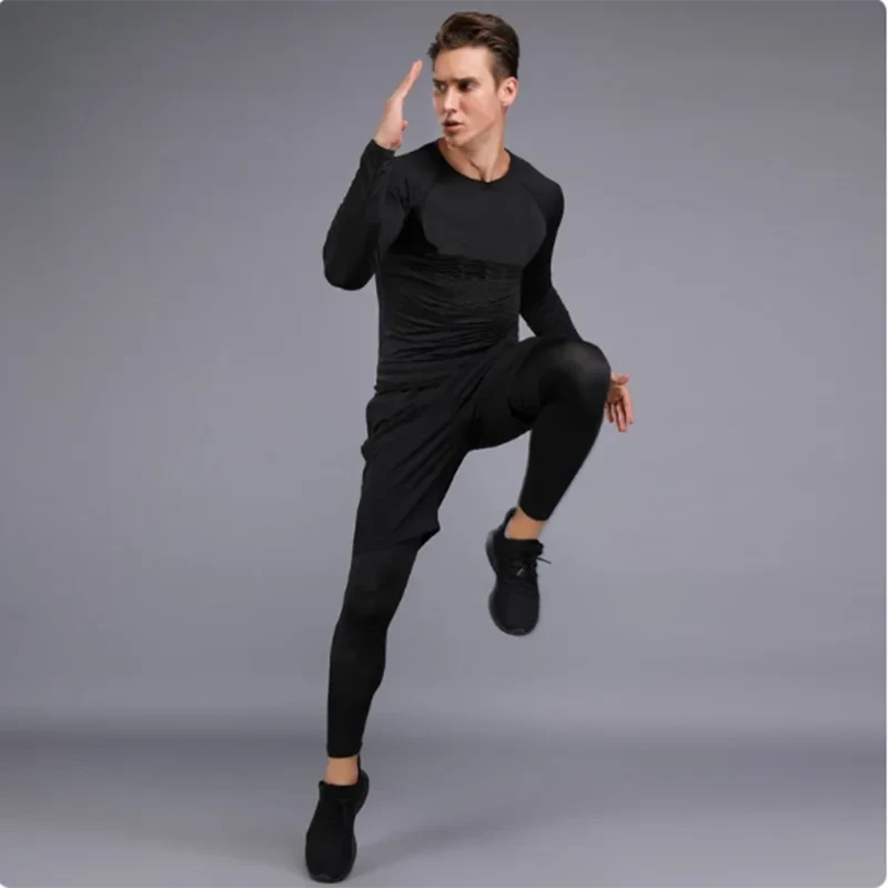 Man performing high knee workout in full black Men's Sports Suit Running fitne male Quick drying Sportswear Compression Clothing Fitness Training kit.